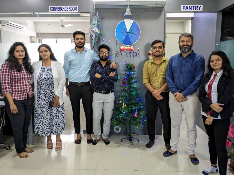 Christmas tree and employees celebrating Christmas at evitalrx pharmacy software office in ahmedabad india. Life at evital