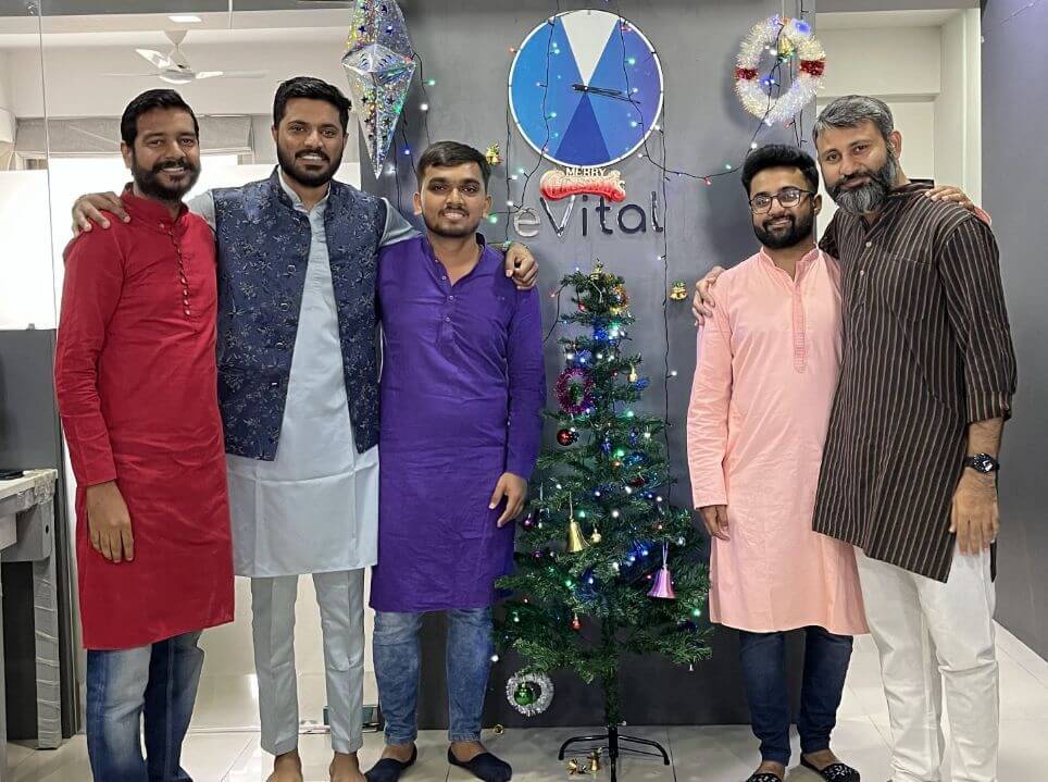 naveen vaibhav avi ajay hamid celebrating christmas at evitalrx office in ahmedabad india with christmas tree. Life at evital